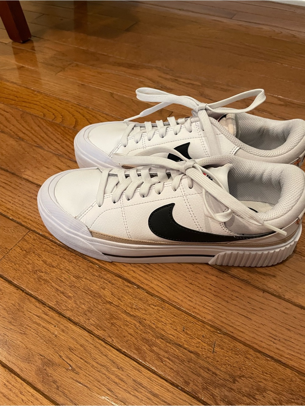 Nike Women’s White Sneakers with Black Swoosh